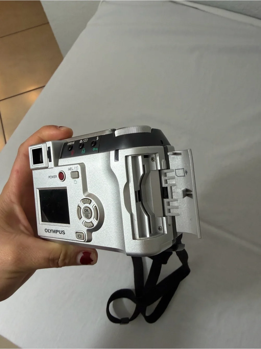 Olympus Silver Compact Digital Camera with Black Wrist Strap